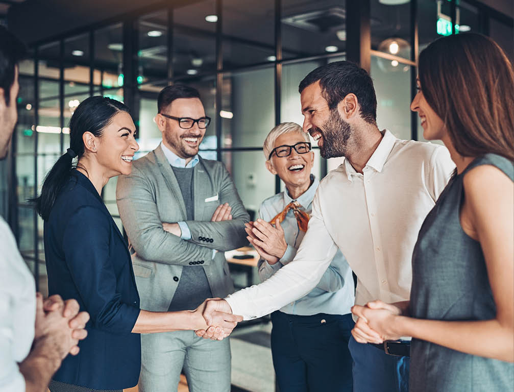 Group of business persons handshake in the office